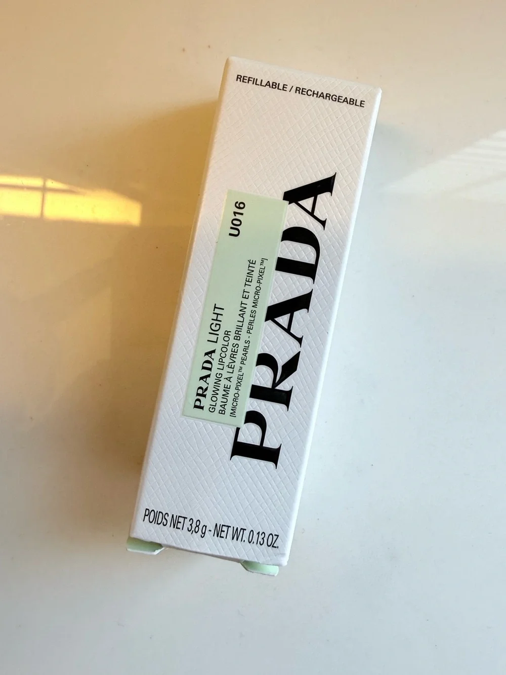 Prada Light Refillable Glowing Lip Oil Stick in Rose U016 Bubblegum Pink